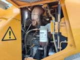 a close up of a machine that is sitting on the ground