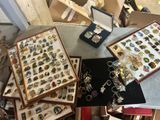 many different types of jewelry in a display case