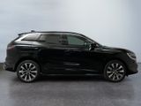 the black suv is parked in a room with a gray floor