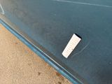 a remote control on the side of a blue car