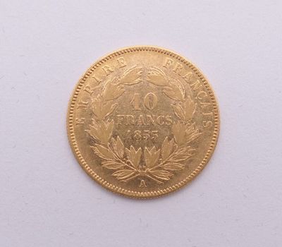 une image d'une pièce d'or sur une surface blanche