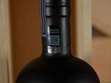 a bottle of wine that is sitting on a table