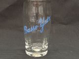 a glass with a blue base that says base you
