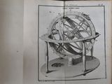an old book with a picture of a sundial on it