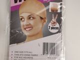 the wig cap is in a plastic bag on a white table