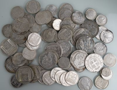 a pile of silver coins on a table