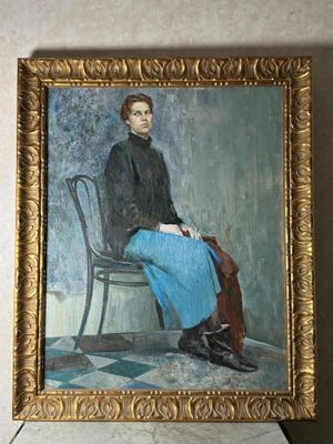 tableau représentant un homme assis sur une chaise, dans un cadre doré