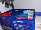 a blue crate with a bunch of electronics inside of it