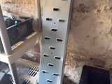 a picture of a metal shelf with a bunch of items