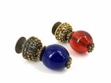 pair of blue and red glass beaded earrings on a white background