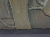 statue of a man with a hat and a cane in a museum