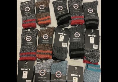 several pairs of men ' s socks sitting on top of each other