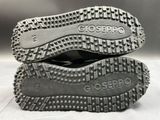 the soles of a pair of shoes with spikes on them