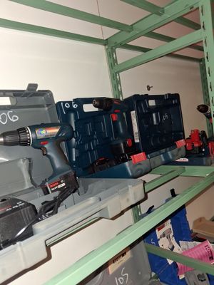 a man that is standing in a room with some tools