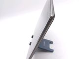 a close up of a cell phone on a stand
