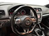 the interior of a car with a steering wheel and dashboard controls