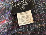 a chanel coat with a label on it