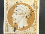 un vieux timbre sur lequel figure le visage d'un homme
