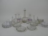 a lot of glass vases and bowls on the table