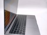 a close up of a laptop computer on a white surface