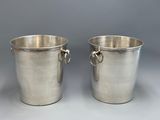 pair of silver plated ice buckets with handles