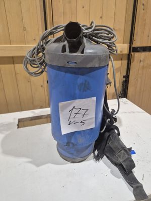 an image of a blue and gray water filterer on a table