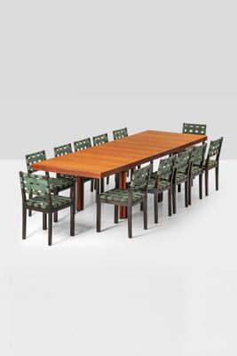 an image of a dining table with six chairs and a large wooden table