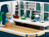 a lego model of a science lab with a man in it