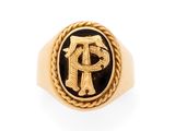 an image of a gold ring with a black and white monogram