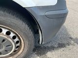 a close up of a tire on a car in a parking lot