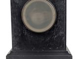 an image of a black marble clock with a silver plate on top