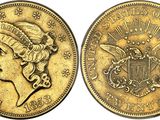 a gold coin with a woman ' s head and a crown on it