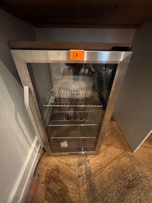 a glass door that is open on a wooden floor