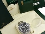a rolex watch in a box on a white background
