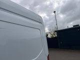 a white van that is parked in a parking lot