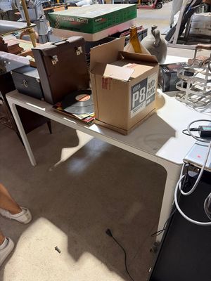 a table that has a bunch of boxes on top of it