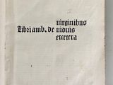 an old book with writing on it sitting on a table