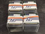 a lot of memory cards stacked on top of each other