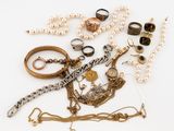 many different types of jewelry on the table