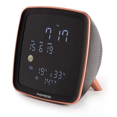 an image of a clock that is sitting on top of a table