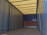 a blue truck that is inside of a building