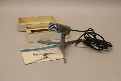 a microphone that is sitting on a table next to a box