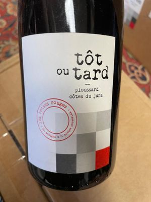 a bottle of wine that is sitting on a table