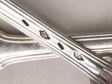 a silver spoon and a fork on a table