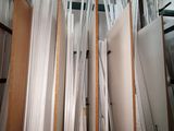 a lot of sheets of paper on a shelf