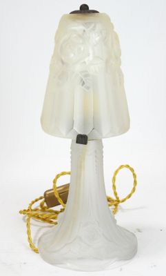 a lamp that is sitting on a table next to a cord