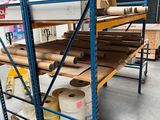 many rolls of paper on the shelves in the warehouse