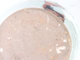 a glass bowl filled with a mixture of brown liquid