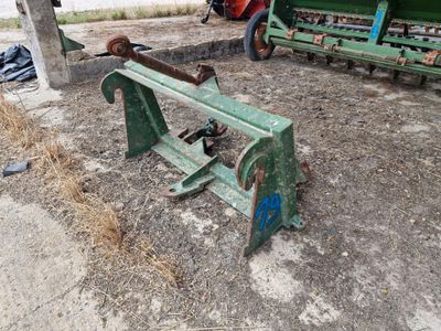 a green machine that is sitting in the dirt