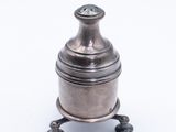 an antique silver plated box on a stand on a white background